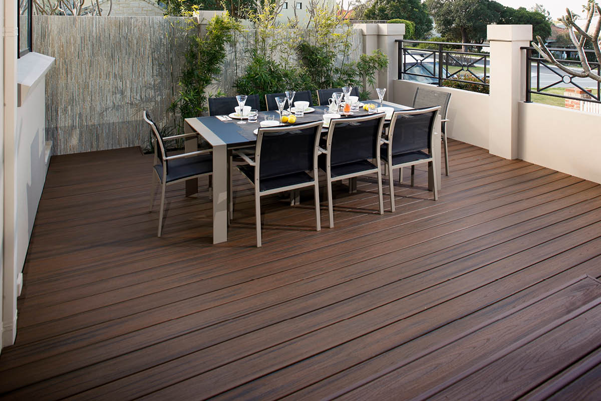 Trex composite deck with outdoor dining table set for entertaining